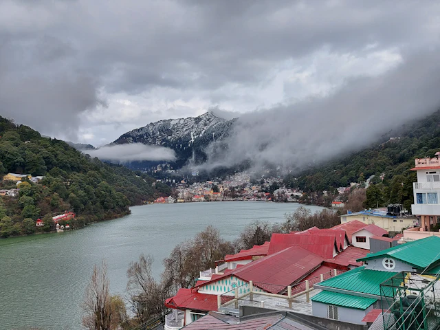 Red-roofed houses on the shore of Naini Lake