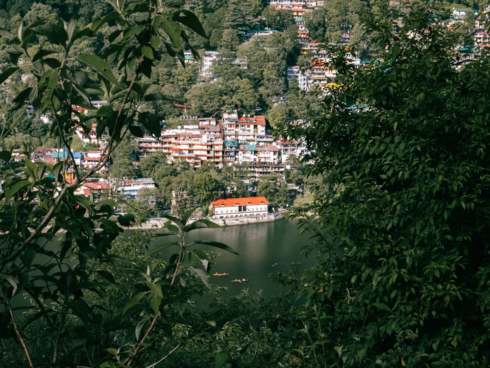 Lakeside town among green hills